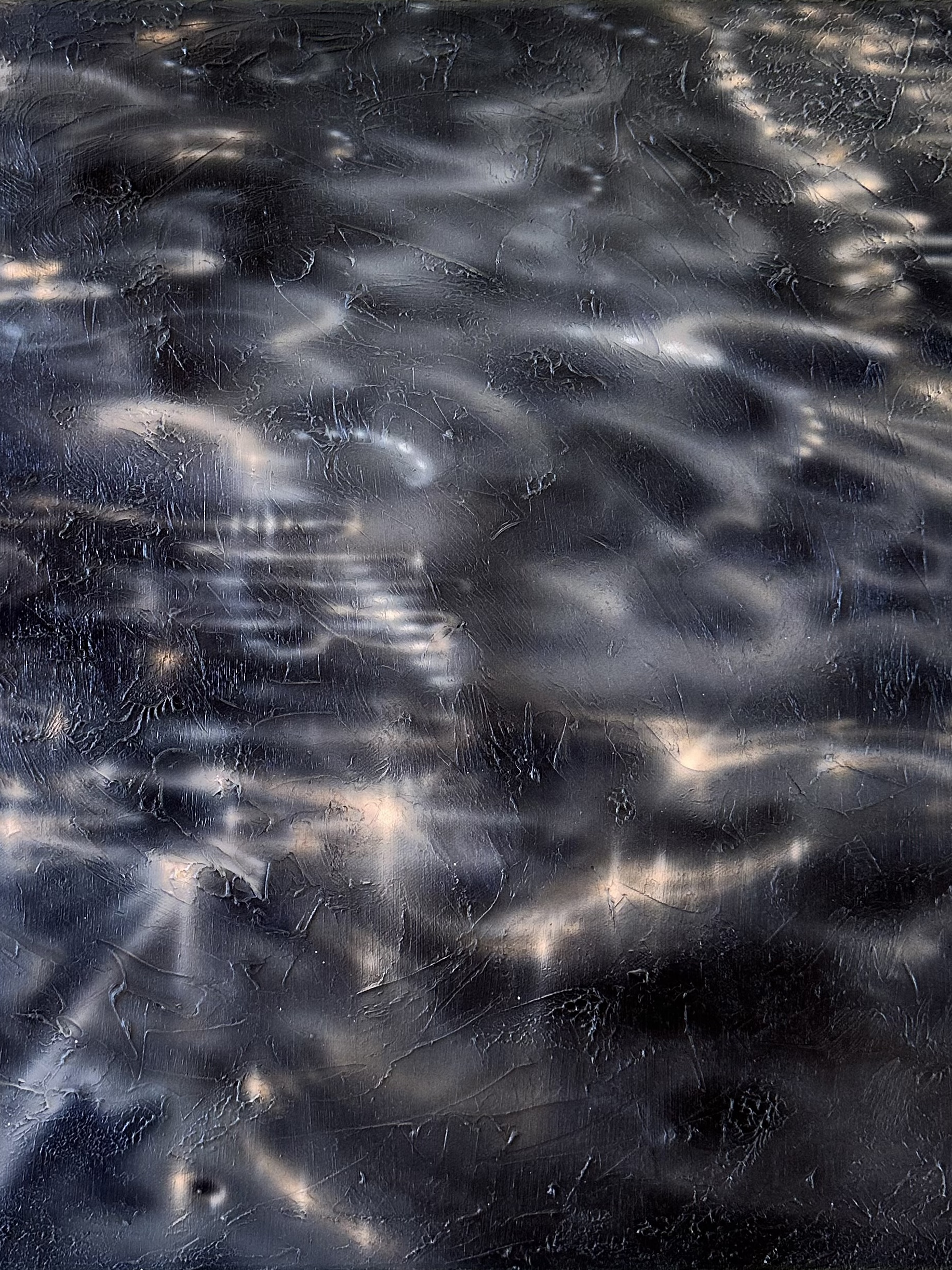Swirls of light on a grey textured background