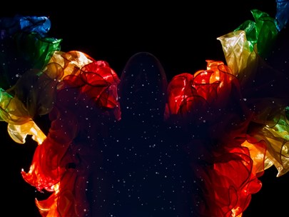 Dean Arcuri as a silhouette of stars with a vibrant rainbow outline