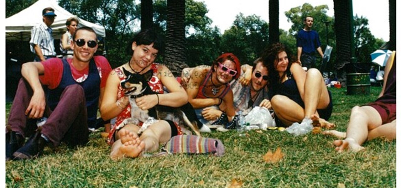 Midsumma Carnival 1996 by Richard Israel and 1997 by Virginia Selleck: several people plus dog sitting on the lawn