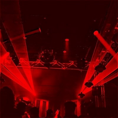 Interior of the New Guernica venue under red lighting