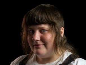 Headshot of Ruby against a black background