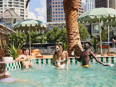 A group enjoying Alfoat's swimming pool