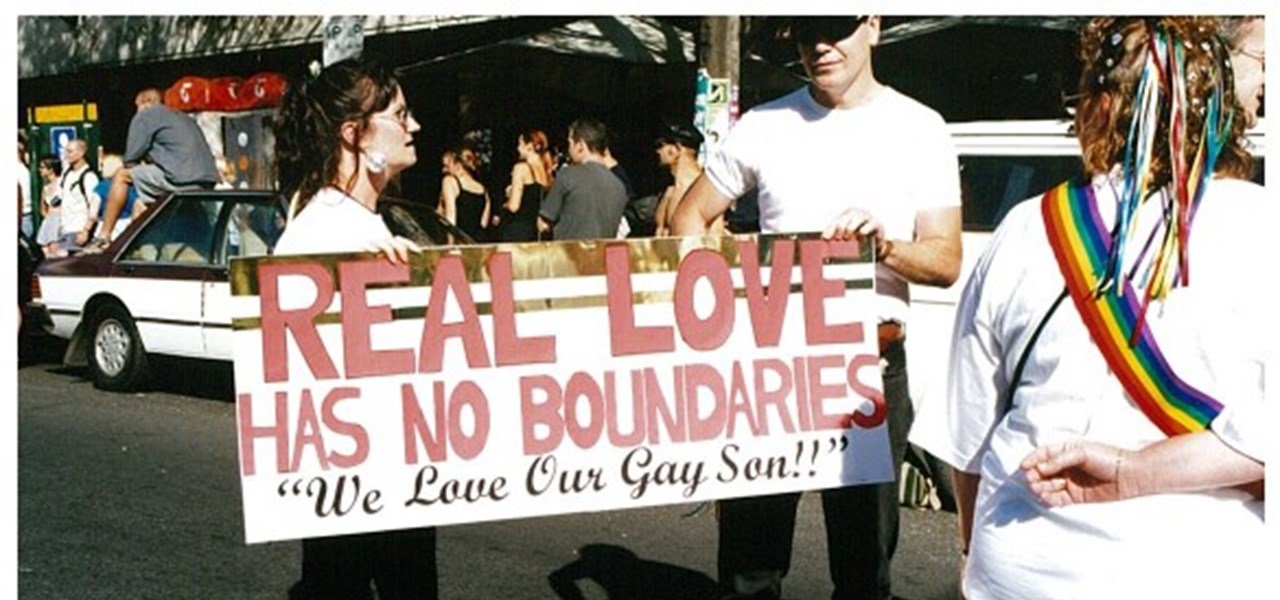 Pride March 2000 image: a banner reading "REAL LOVE has no boundaries (we love our gay son)"