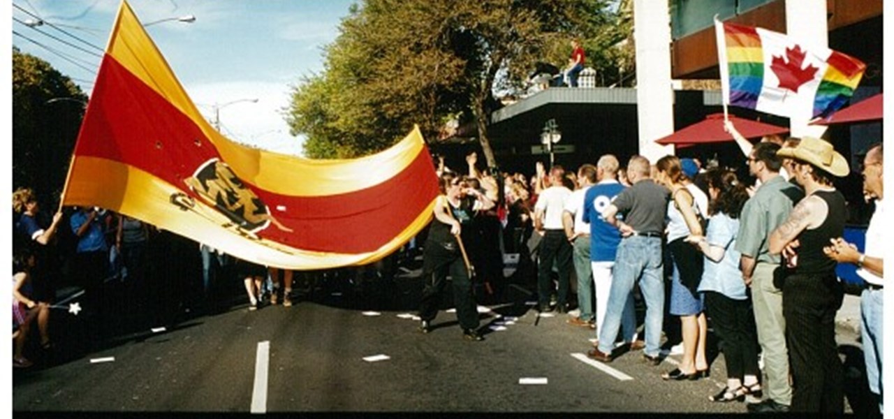 Pride March 2000 image: a large red and gold flag
