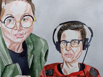 Two people wearing headphones: image 1 zoomed in