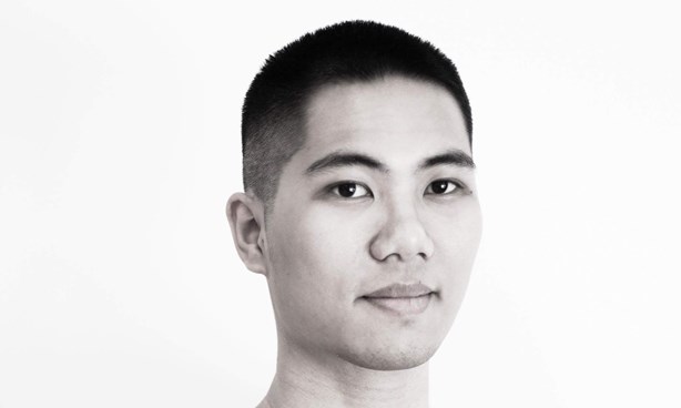 Black and white headshot of Thang Do in a v-neck t-shirt