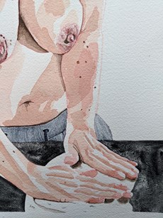 A topless female kneading dough: the hands