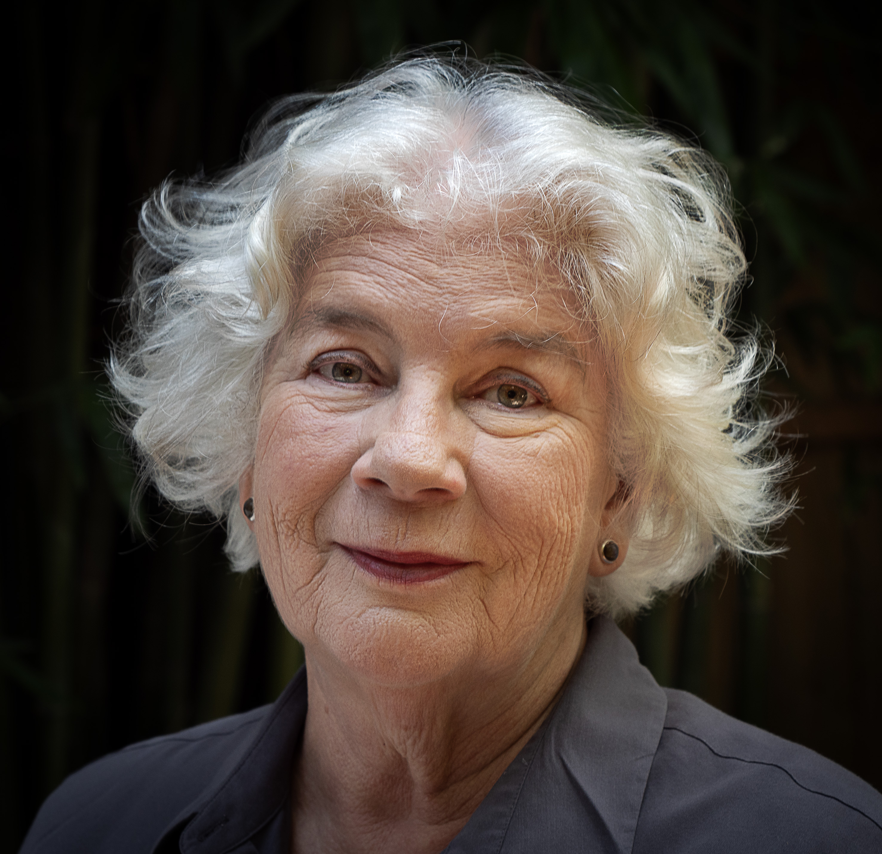 Headshot of Meredith Rogers against a black background