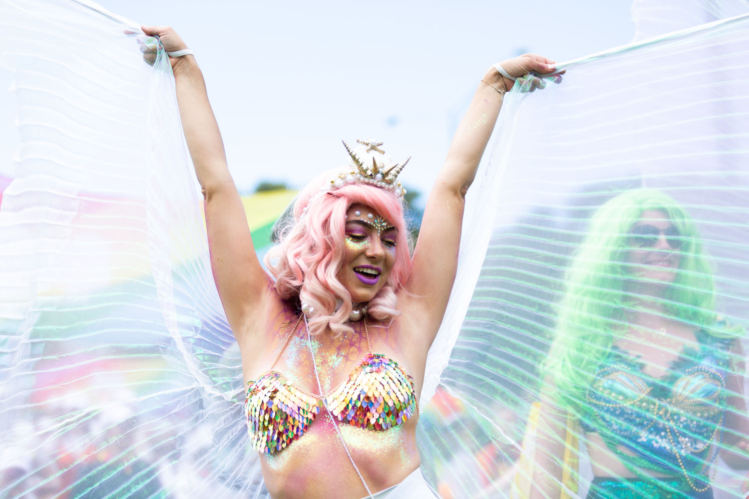Gossamer-winged person dancing at Midsumma Pride March