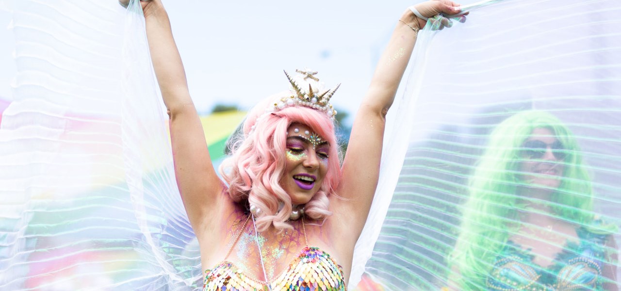 Gossamer-winged person dancing at Midsumma Pride March