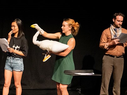 People on stage reading a play as part of the Queer Playwriting Award Showcase 2020