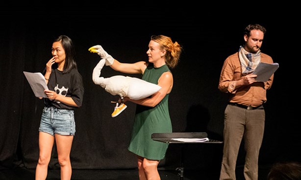 People on stage reading a play as part of the Queer Playwriting Award Showcase 2020