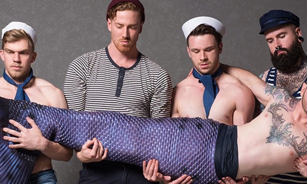 Four sailors, two bare-chested, holding a bare-chested merman horizontally