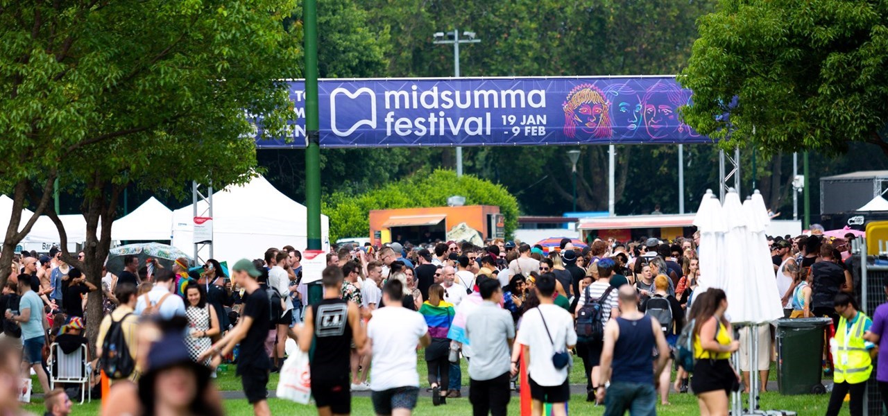 The crowd at Midsumma Carnival, with a prominent Midsumma Festival banner overhead