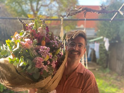 Martin Broadley holding a large bunch of flowers
