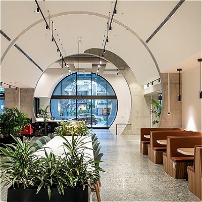 A large open space with banked seating and a workspace