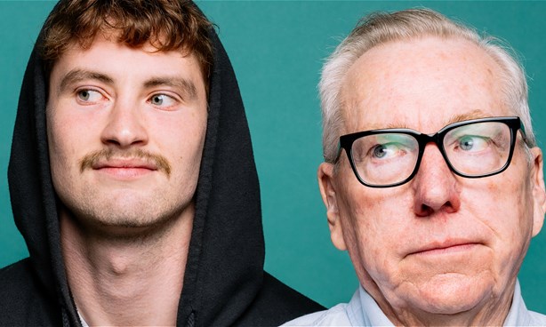 A young man dressed in a black hoodie and an old man wearing a shirt and glasses