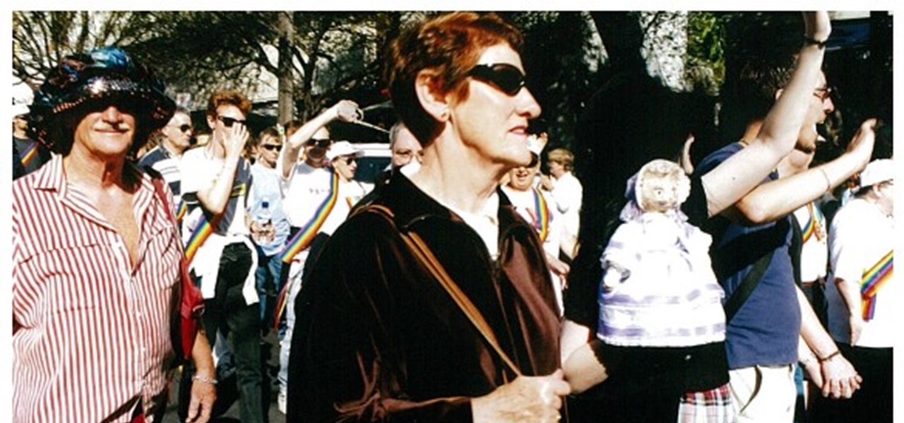 Pride March 2000 image: a middle-aged, middle-class looking woman marching