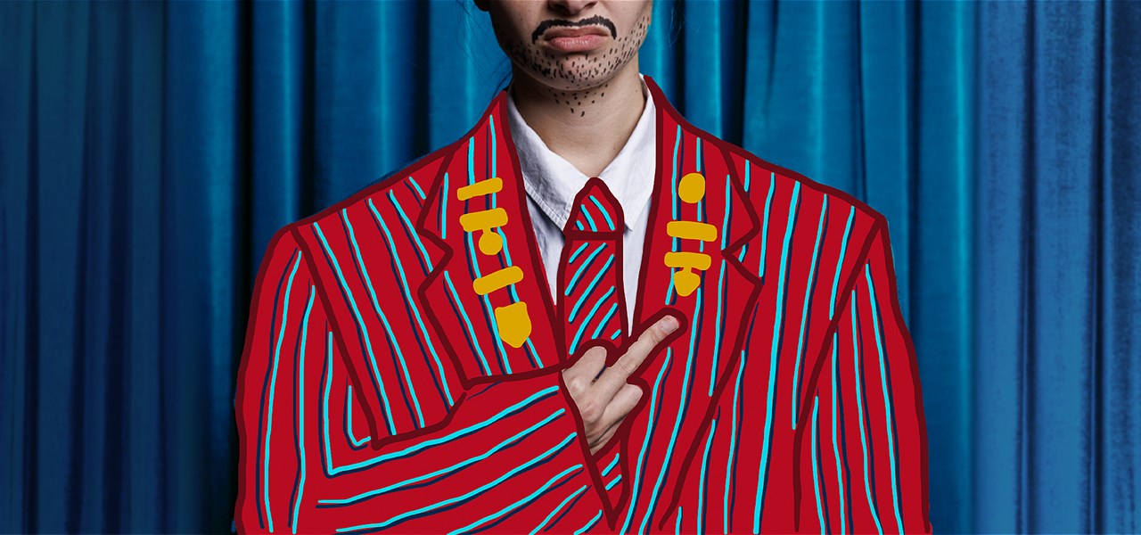 Person dressed in a red school blazer standing in front of a curtain. Head is truncated - only the mouth is visible.