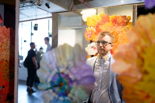 Samuele Tomasulo in front of his work at the exhibition