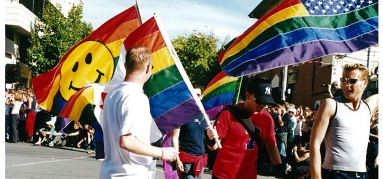 Pride March 2000 image: several people carrying large flags