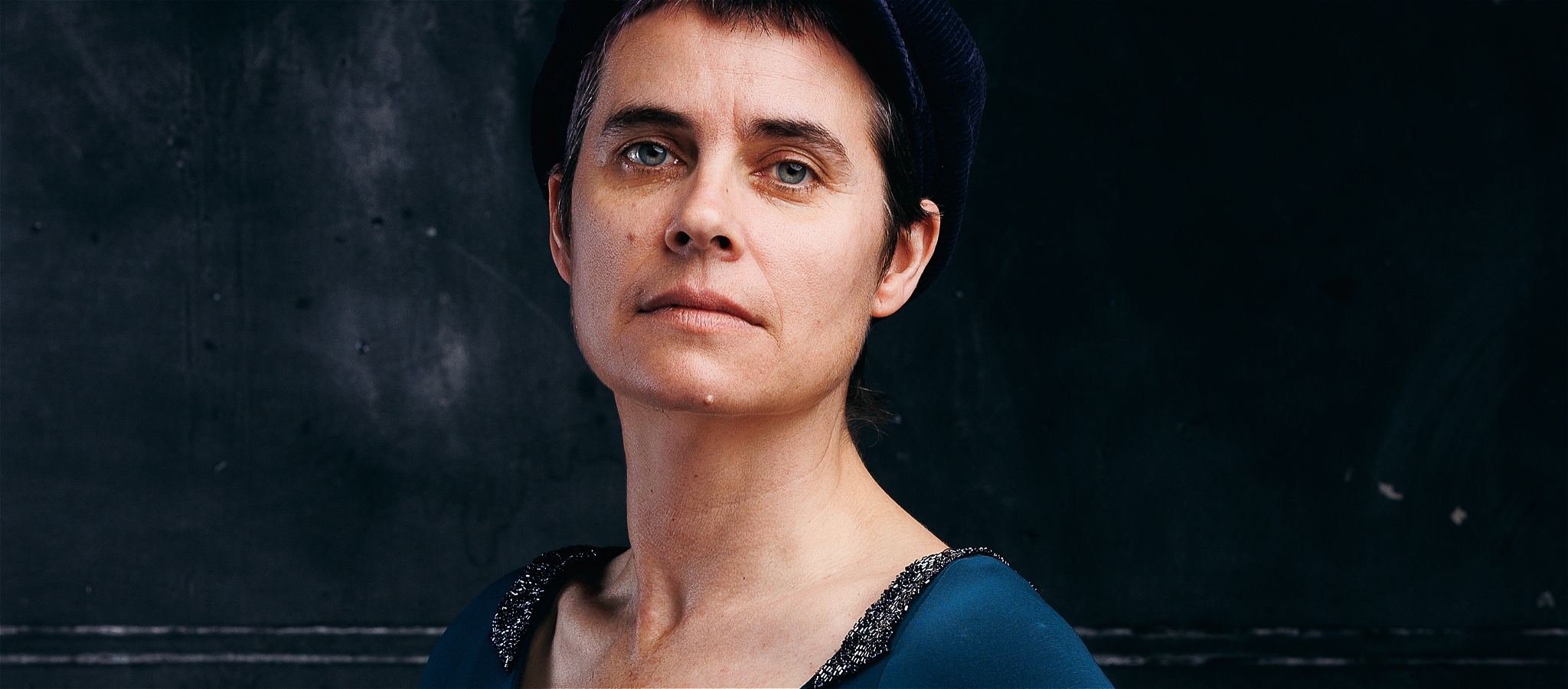 Portrait of pianist Danaë Killian's face and clavicle.