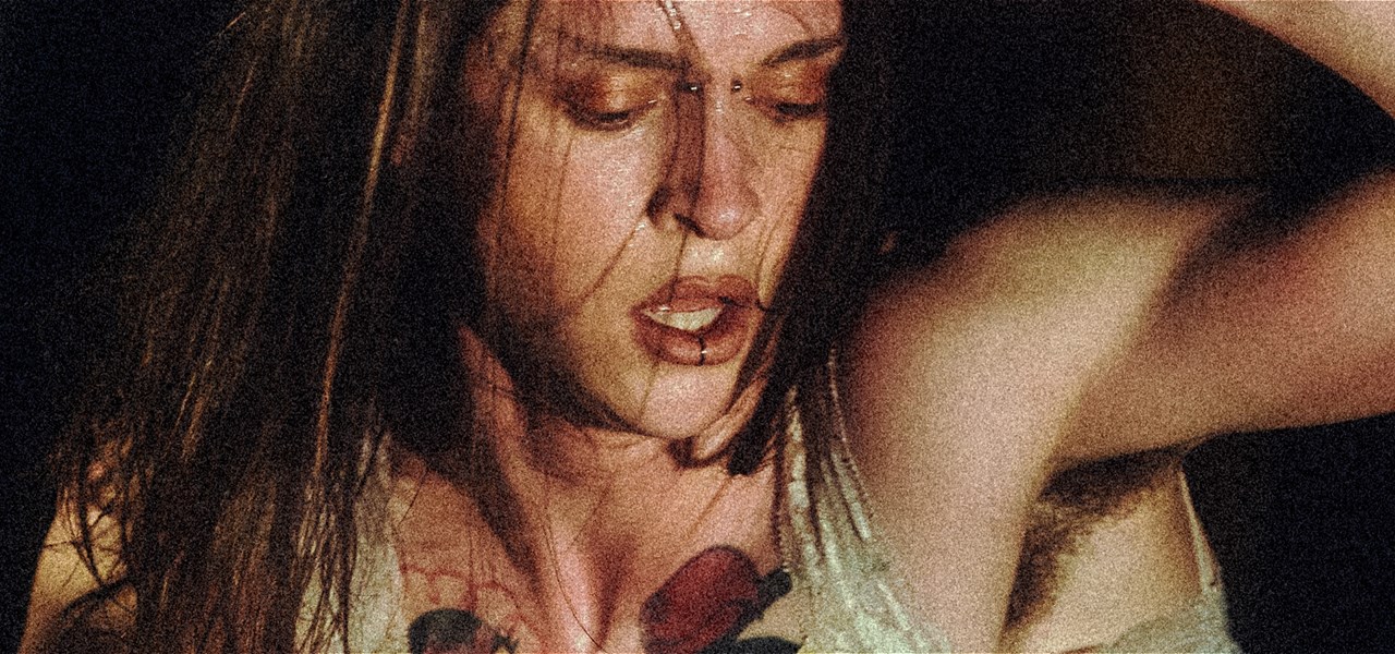 A cropped image of Alexander Powers in the throws of movement. Sweat drips from her face as she pants for breath.