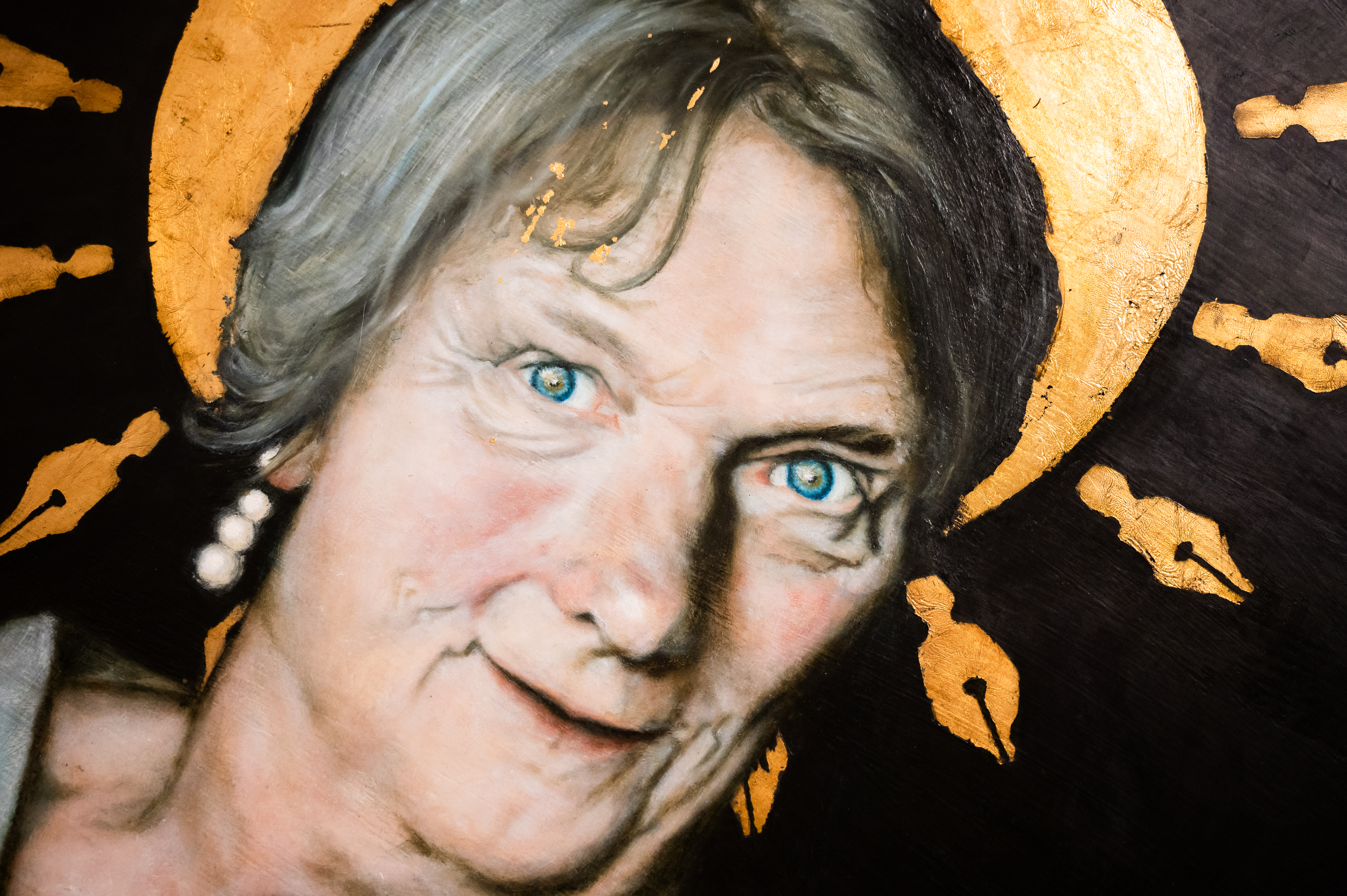 Painting that is a headshot of a person wearing a golden halo