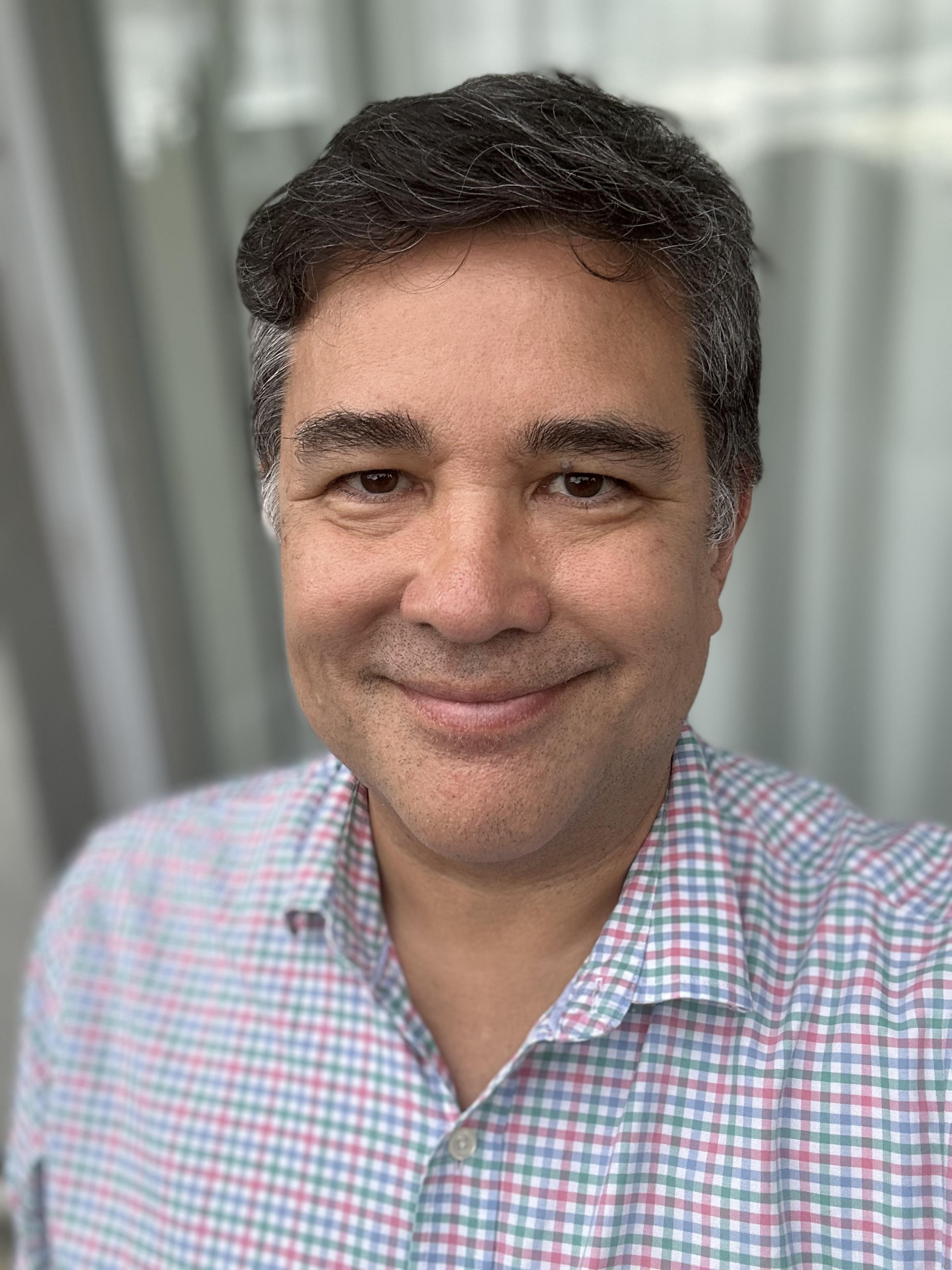 Headshot of Kristof Mikes Liu