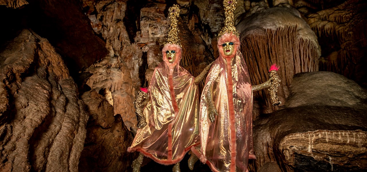 The Huxleys in a cave, dressed as glamorous stalactites 