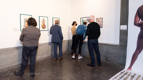 Audience viewing the works in the gallery