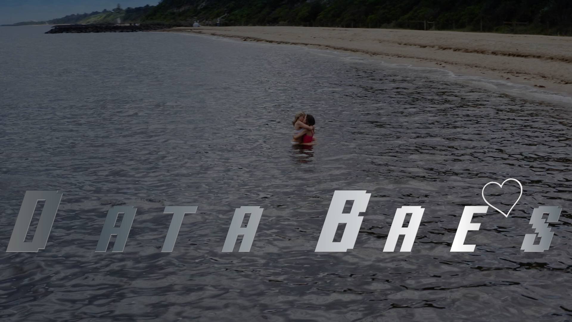A photo of a beach with text at the bottom - DATA BAES