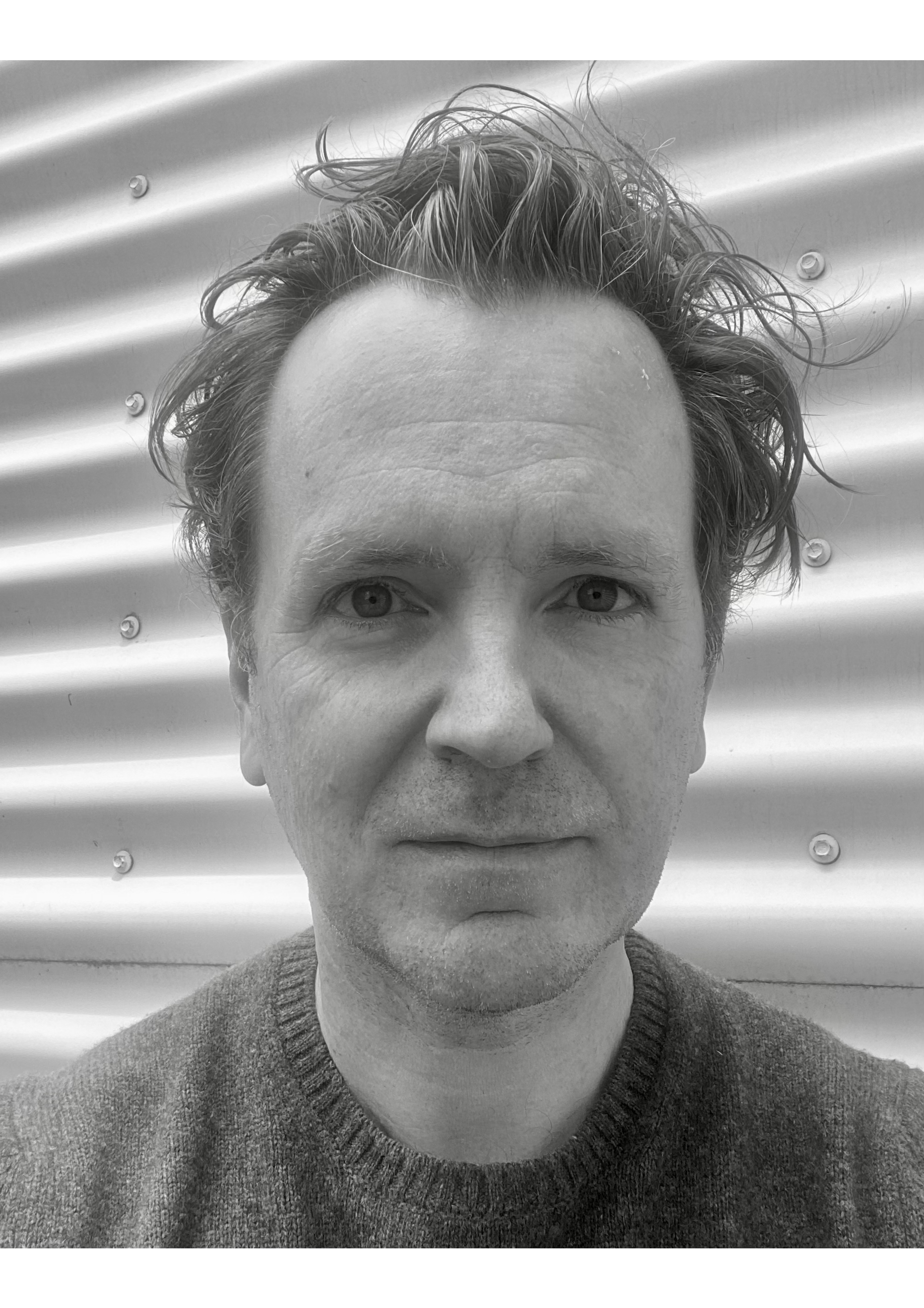 Black and white headshot of Ian Moorhead