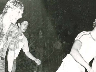 Two skaters at the inaugural GaySkate, held at the Footscray Rollerskating Centre, 1981.