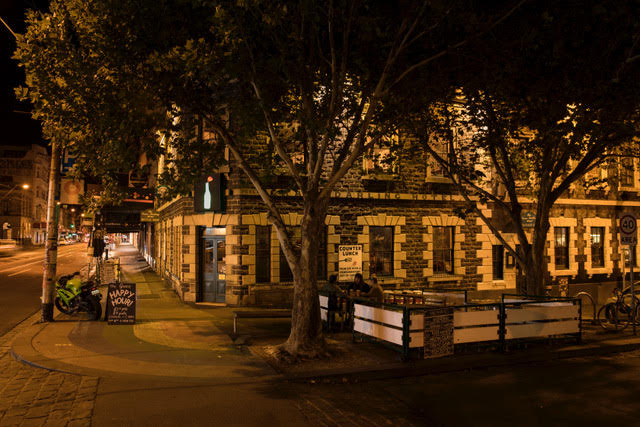 Photo of the exterior of the Grace Darling Hotel at night