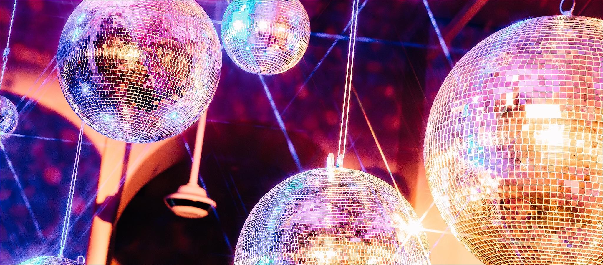 Five shiny mirror balls