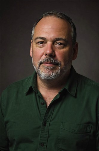 Headshot of Scott Campbell against a dark background