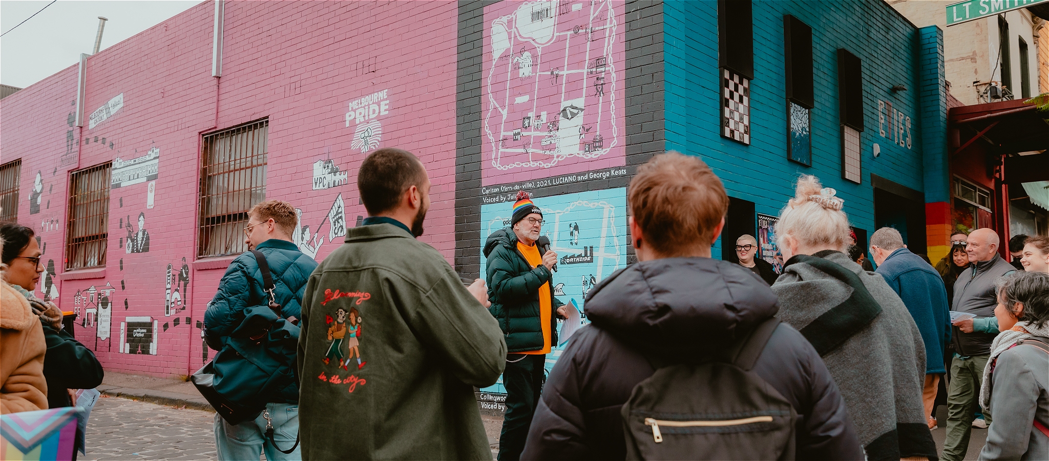 Tex, Tour Guide speaks outside Queerways Mural