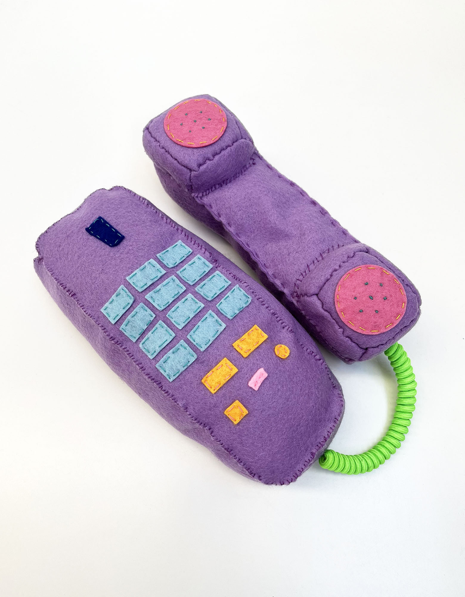 Artwork named Transient by Gabe Love - a fabric model of a mauve coloured, old style telephone