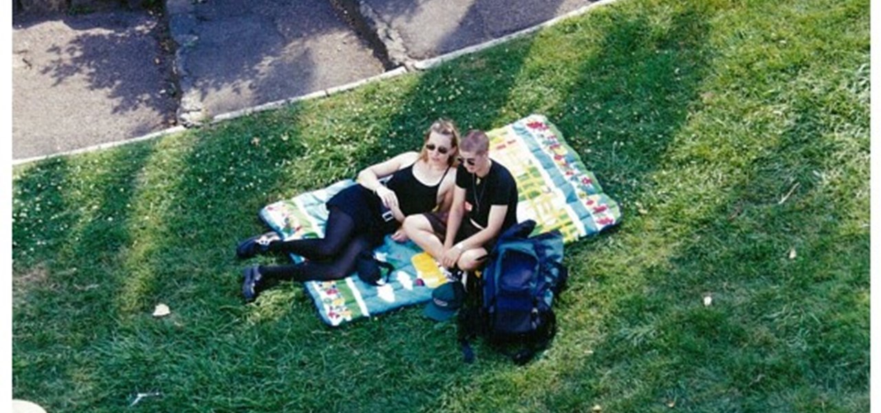 Midsumma Carnival 1996 by Richard Israel and 1997 by Virginia Selleck: two people on the lawn sitting on a mat
