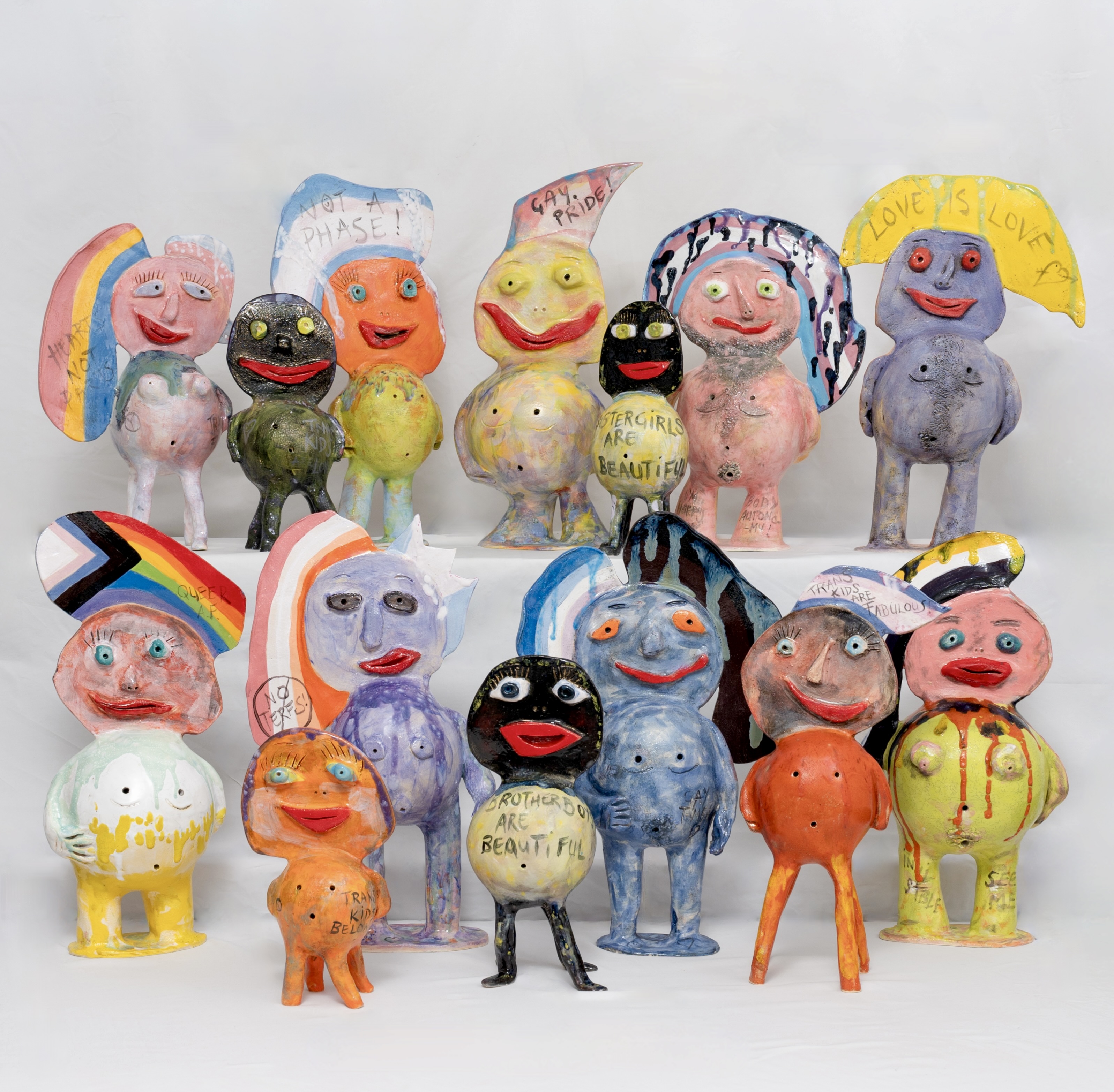 Lots of ceramic statues aligned as though posing for the camera