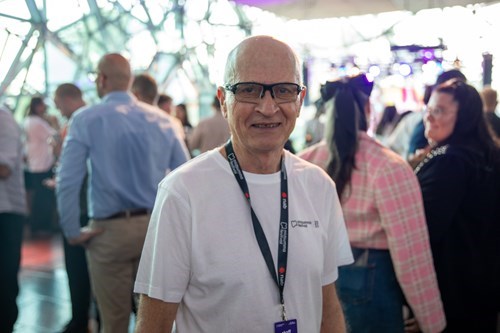 Alan Drummond at the 2026 Midsumma Launch with the crowd in the background