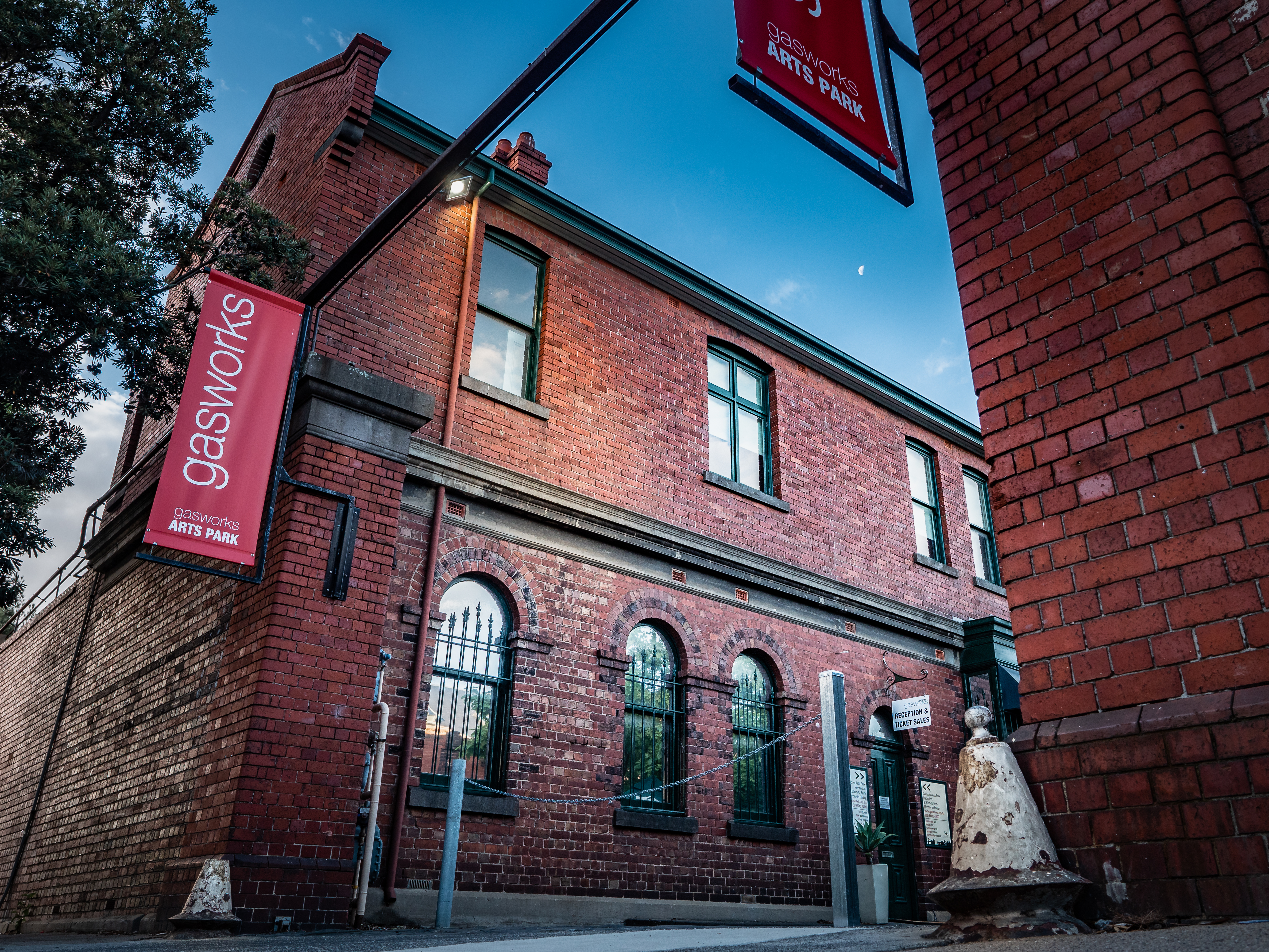 Photo of the main entrance to the Gasworks Arts Park complex showing brick Victorian-era buildings