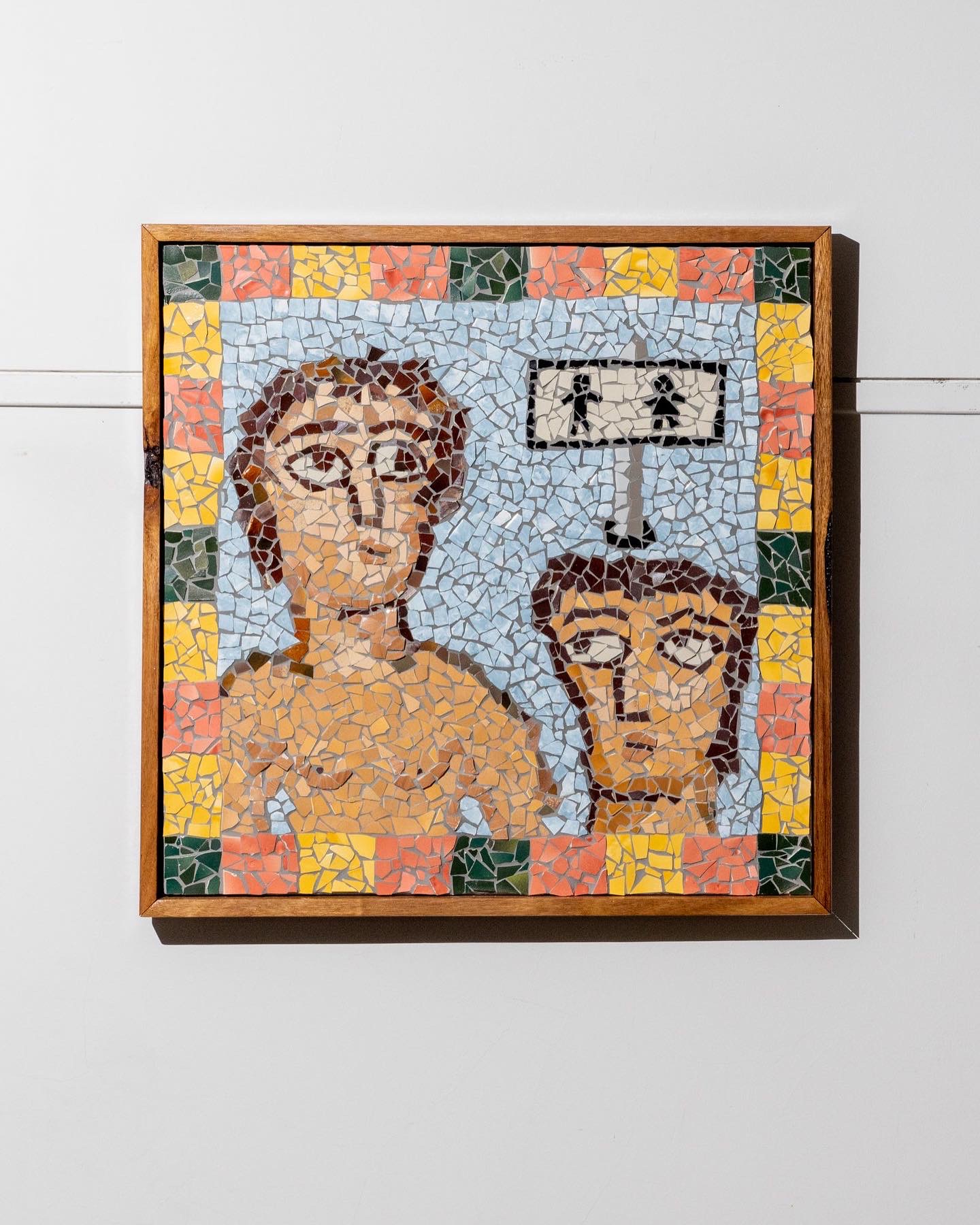 Ceramic mosaic of two human figures - similar to what one might find at Pompeii