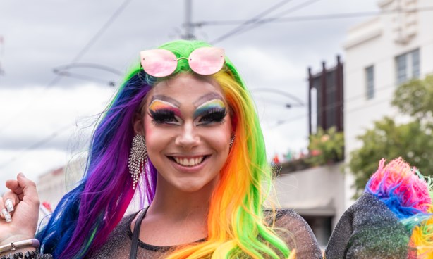 Female-identifying Midsumma Pride March participant with long, rainbow coloured hair