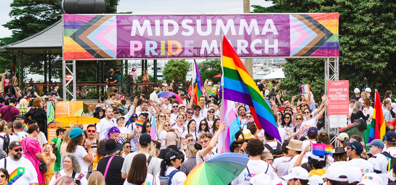 March participants under a banner that says Midsumma Pride March
