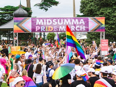 March participants under a banner that says Midsumma Pride March