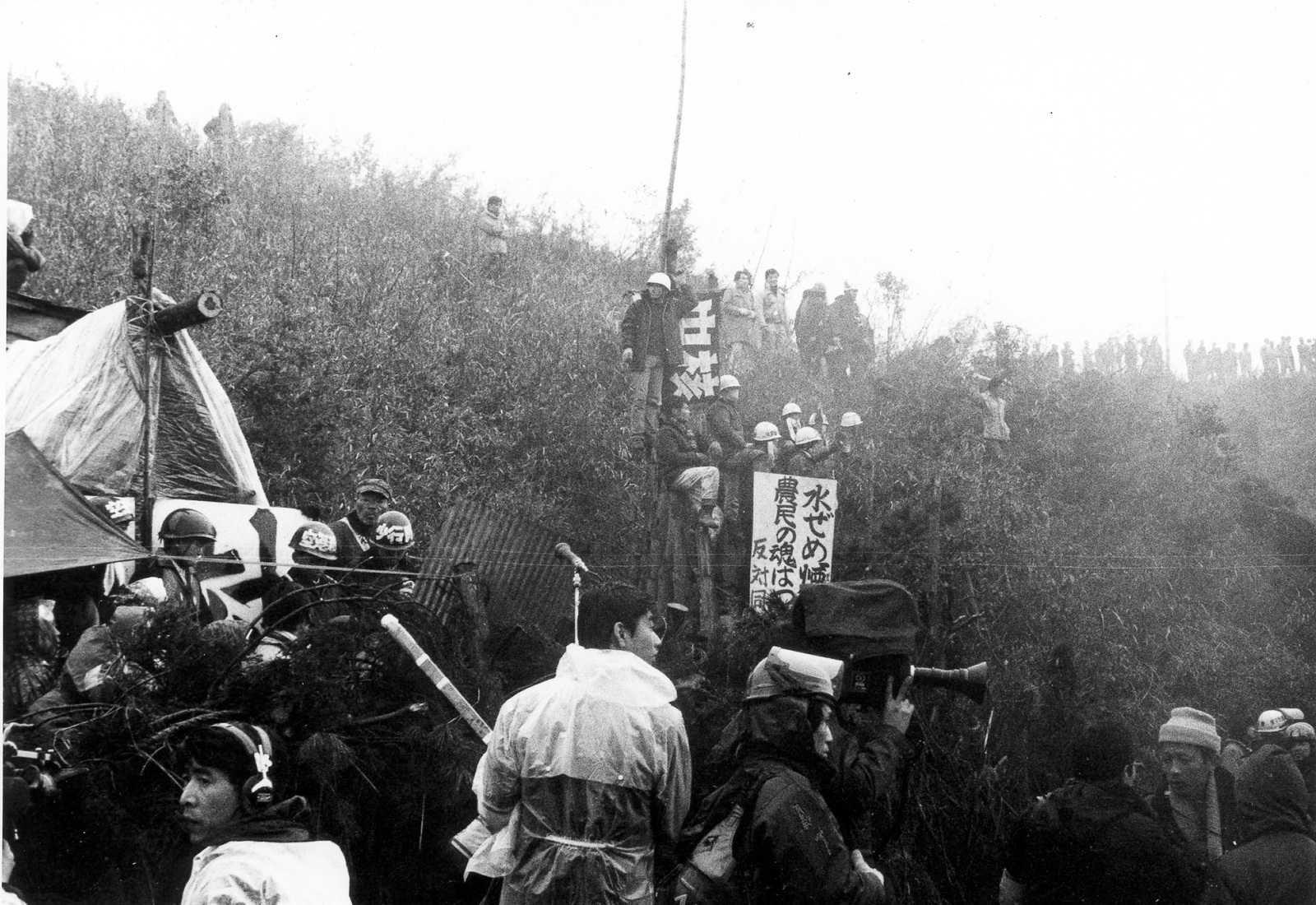 Black and white photo of what looks like a film set in rural Asia