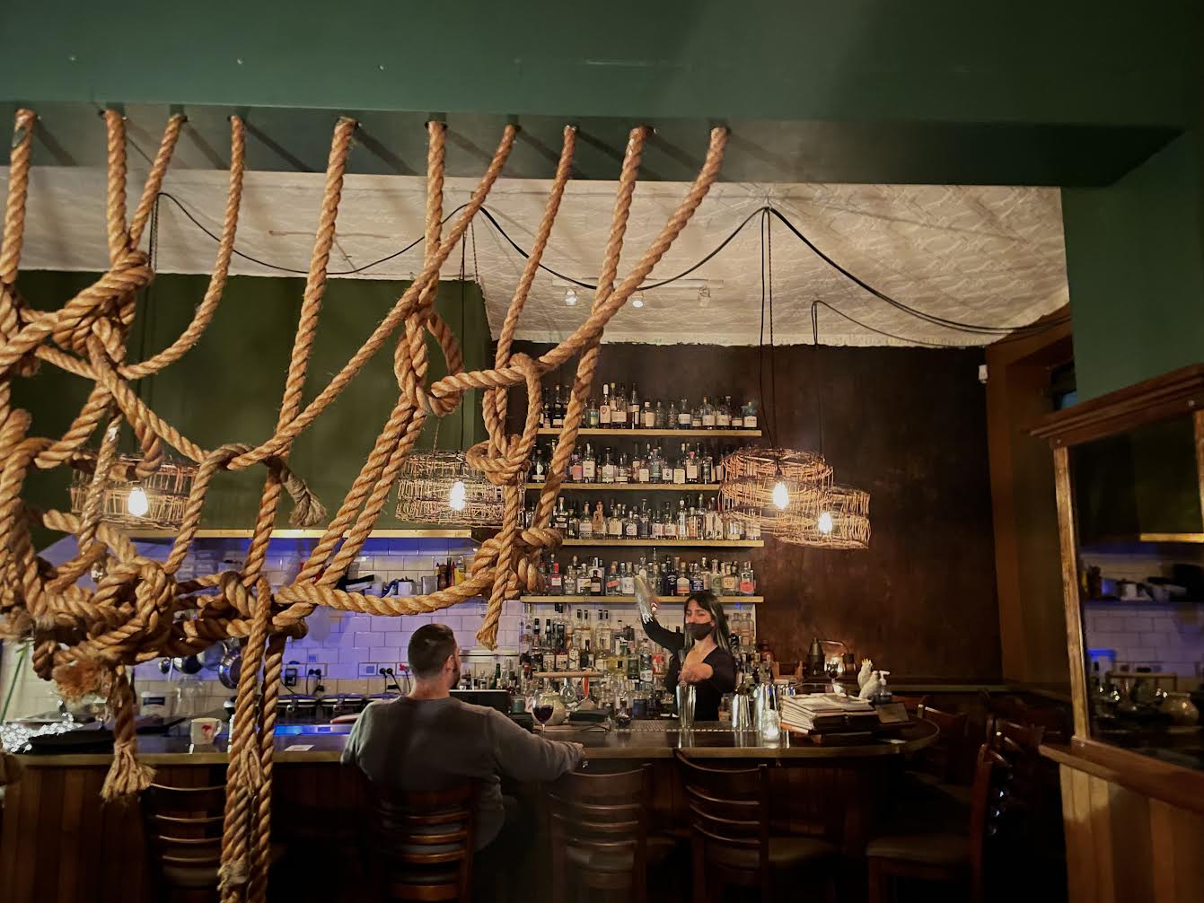 Photo of interior of Bad Frankie, with large ropes hanging in the foreground