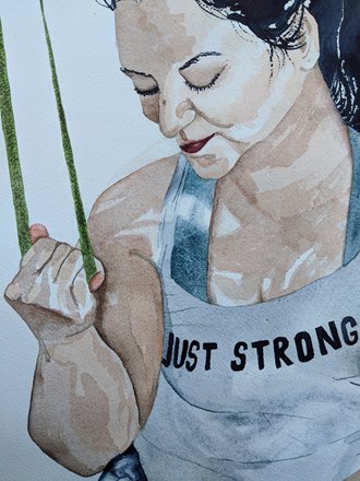 A female exercising with a theraband: focus on the band